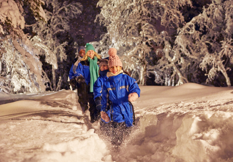 smiling family fun in snow